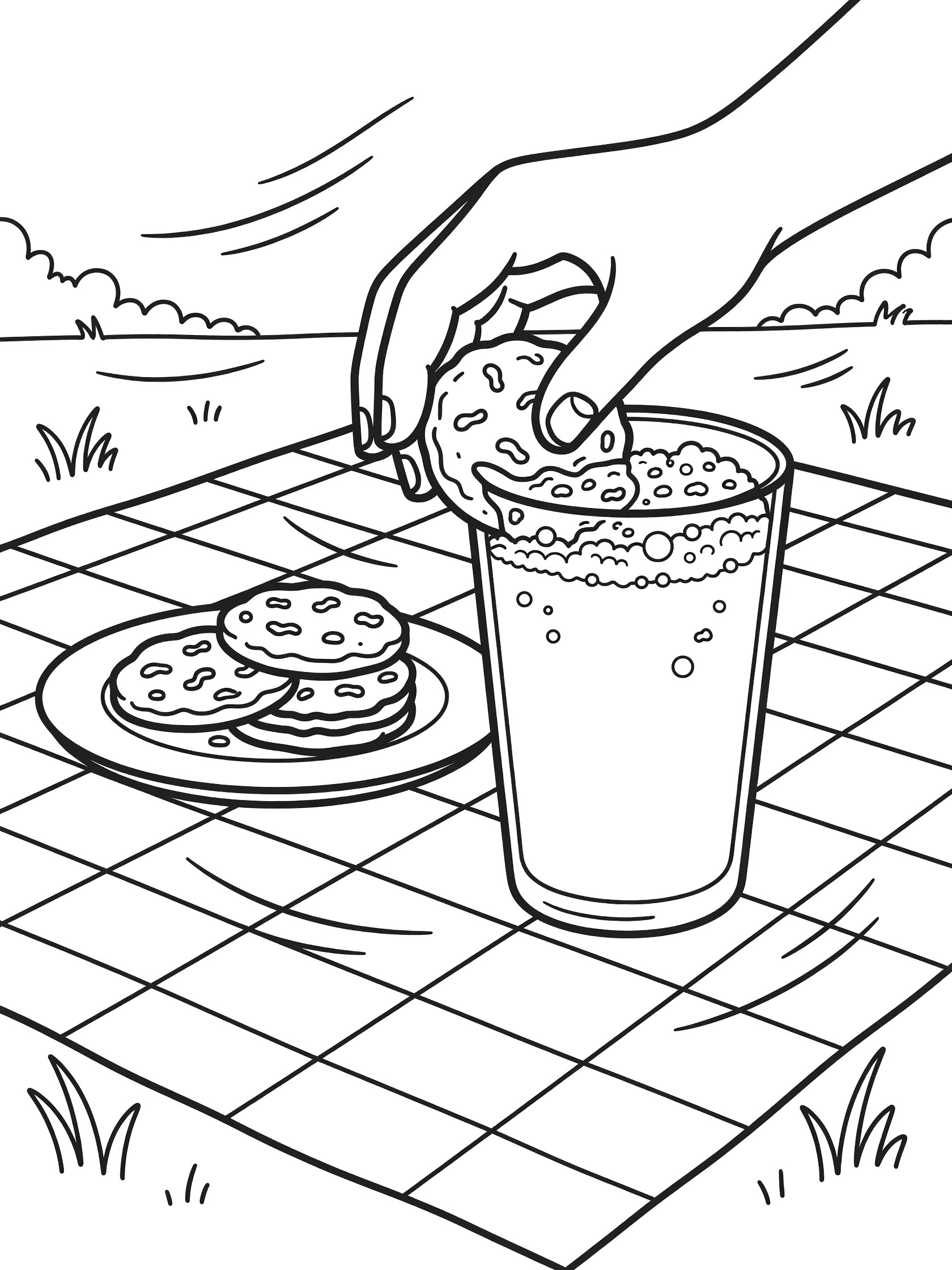 Line art coloring page showing a hand dipping a chocolate cookie into a foamy glass of milk with crumbs floating, cookies on a plate, picnic tablecloth, and grass in the background.