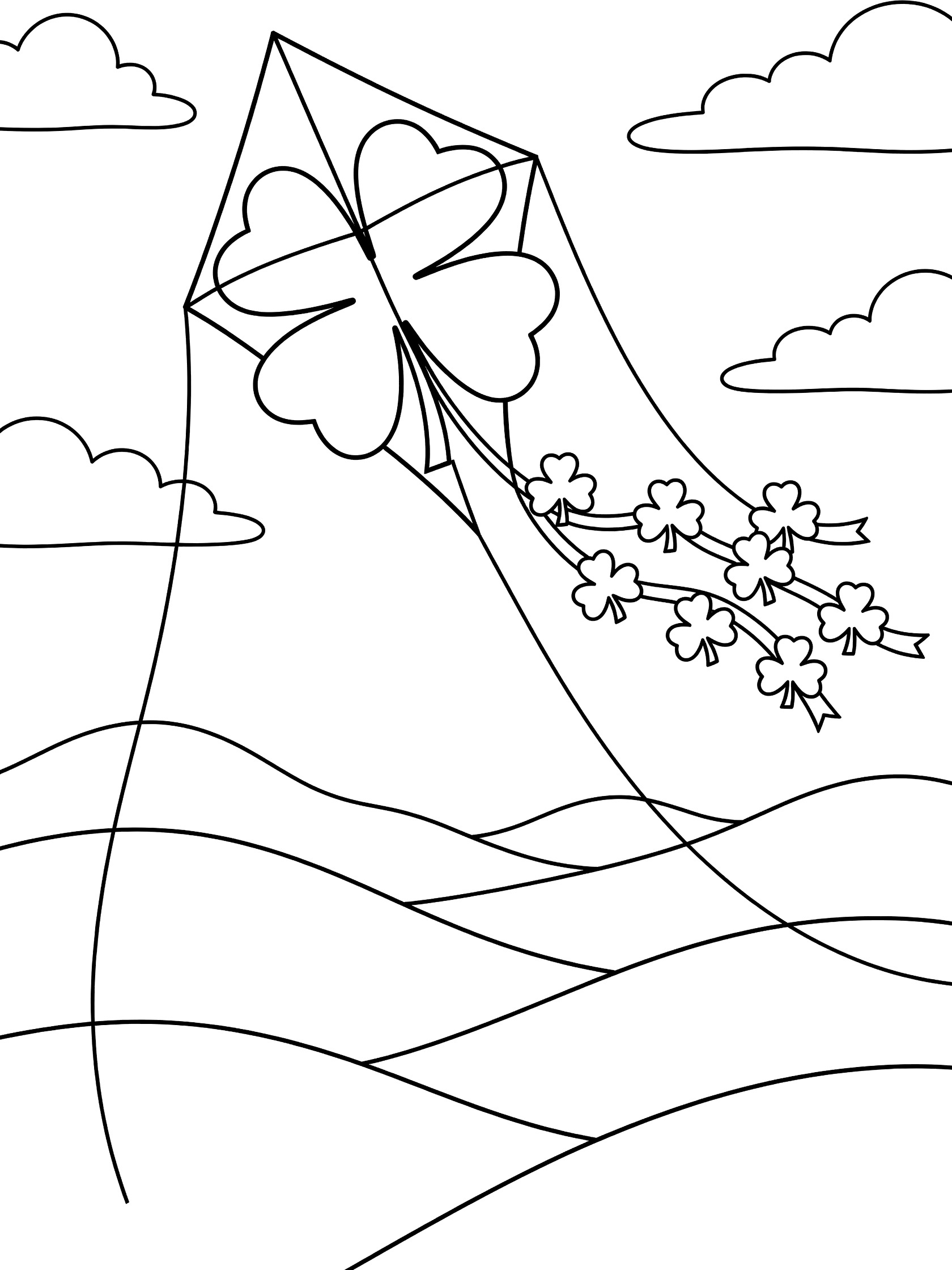 Line art coloring page showing a kite shaped like a four-leaf clover flying high above wavy green hills, with a tail of shamrocks, clouds, and string on a white background.