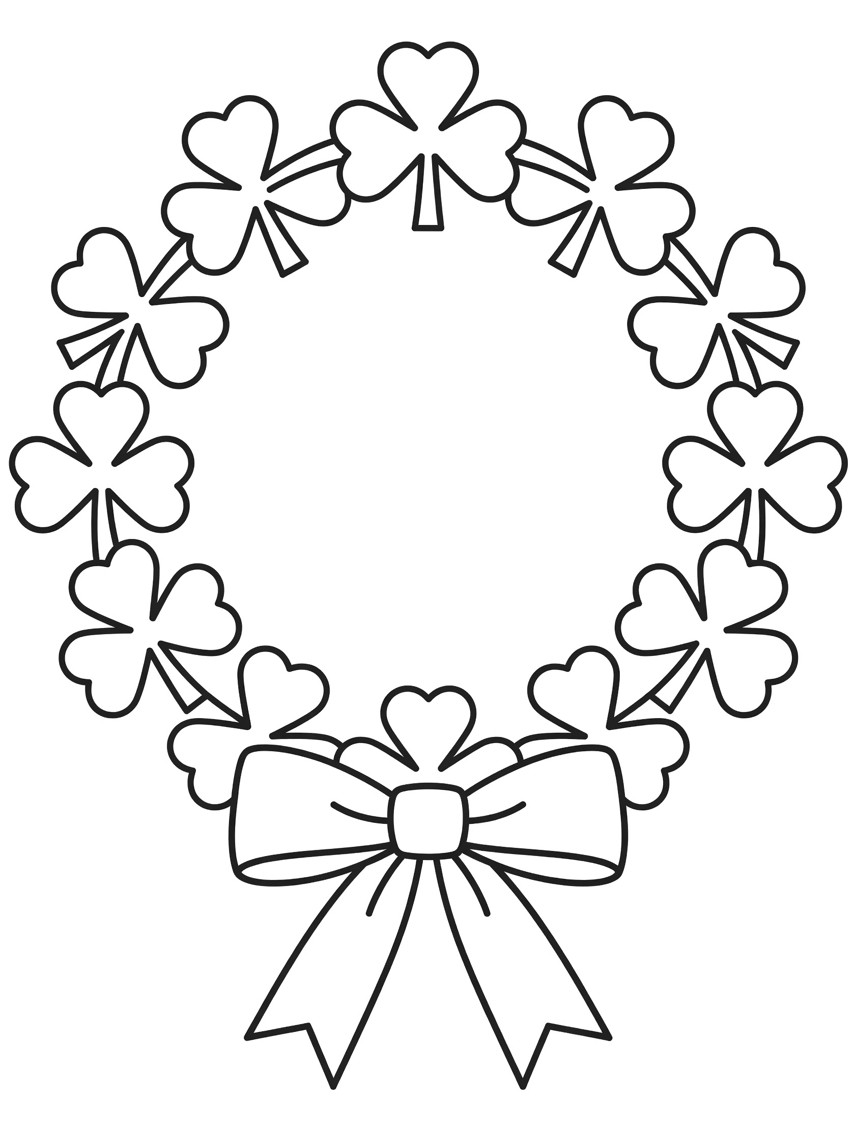 Black and white line art of a four-leaf clover wreath with ribbon bow, perfect for St. Patrick's Day coloring.