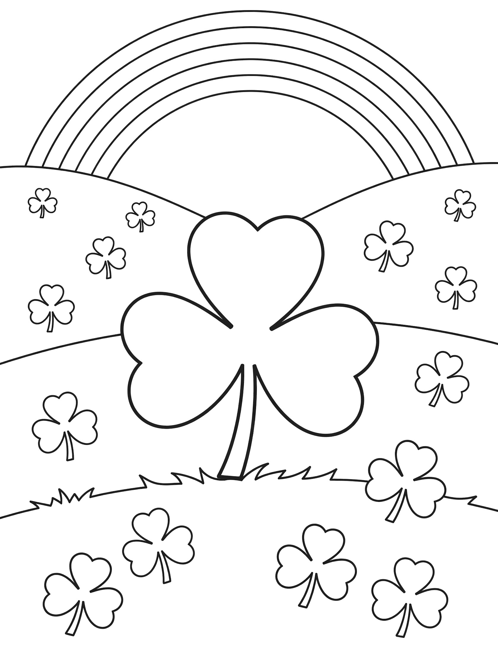 Black and white line art coloring page of a large four-leaf shamrock in an Irish meadow with smaller three-leaf shamrocks, hills, rainbow arc, and front clover patch
