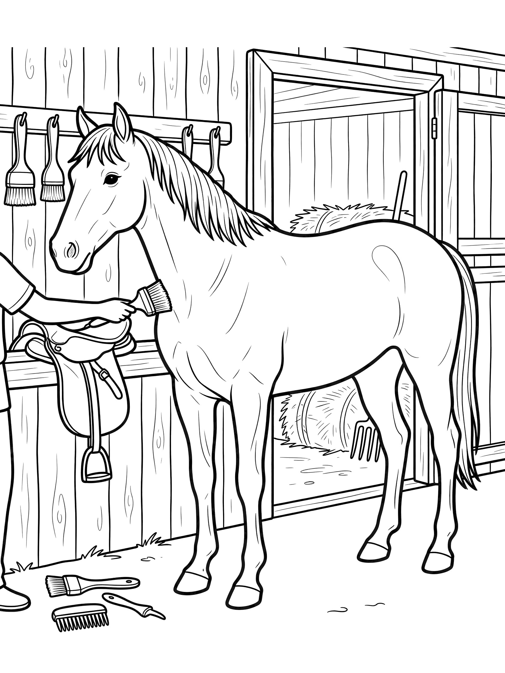 Black and white line art coloring page showing a horse in a wooden barn being brushed by a person's hand, with hanging brushes, saddle, hay, and stable walls.
