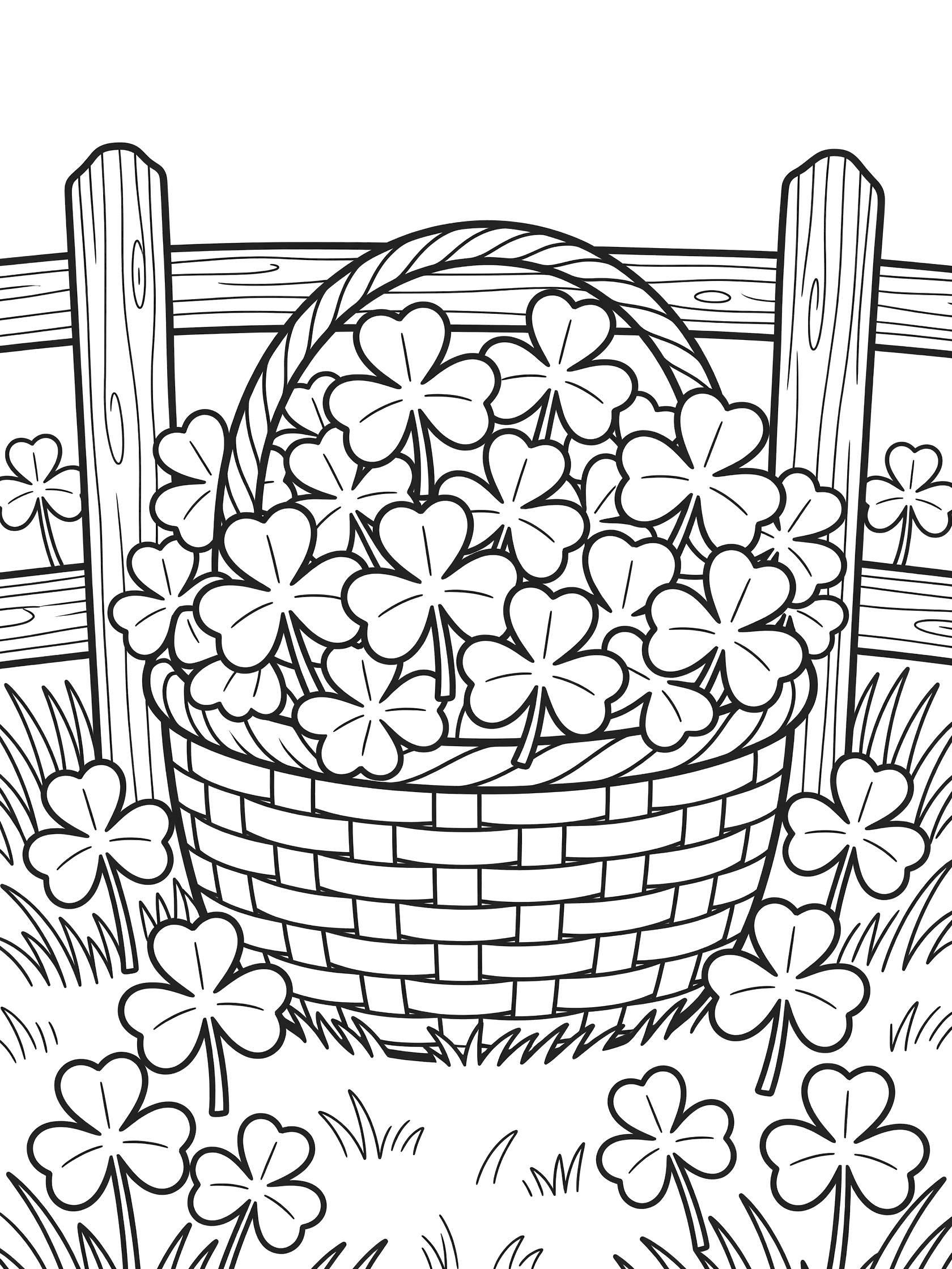 Black and white line art coloring page showing a basket overflowing with shamrocks beside a wooden fence on a grassy meadow