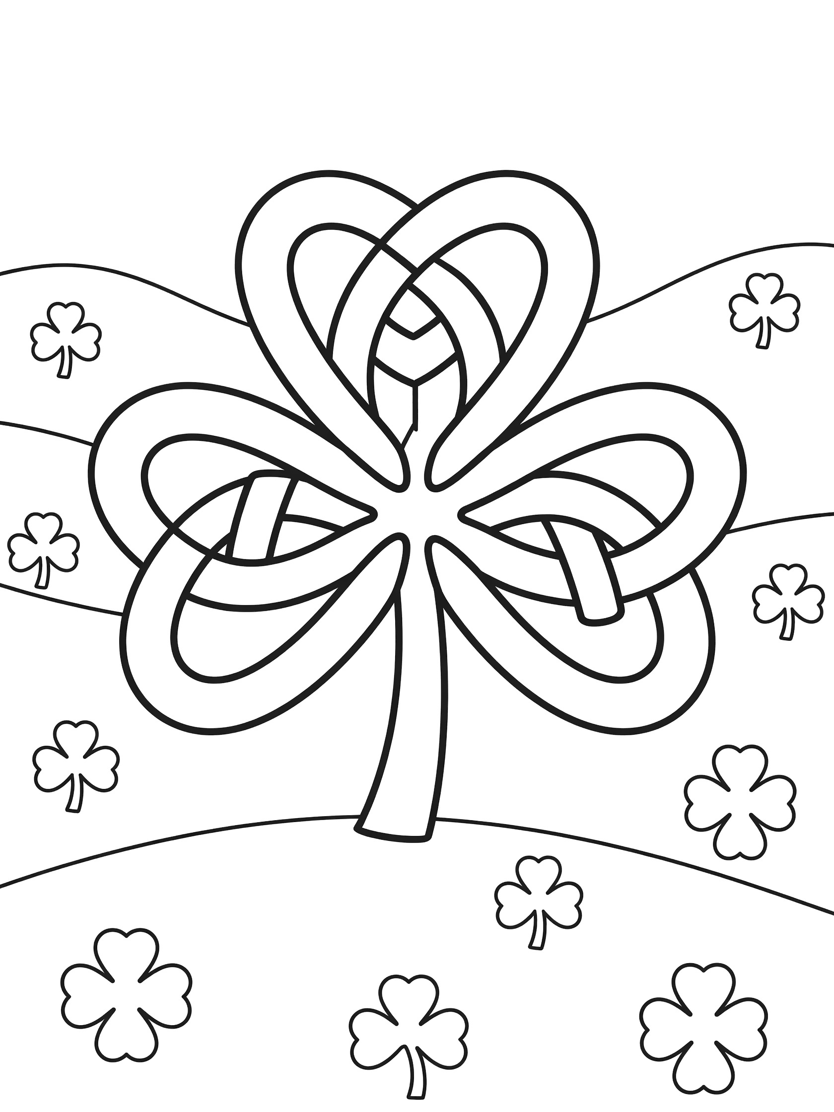 Black and white line art of a large central shamrock made from interwoven Celtic knot bands with three bold leaves and a stem, plus hills and small clovers in the background.
